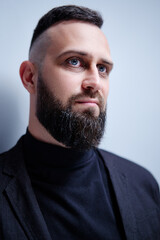 Obraz premium Studio portrait of young handsome man with beard.