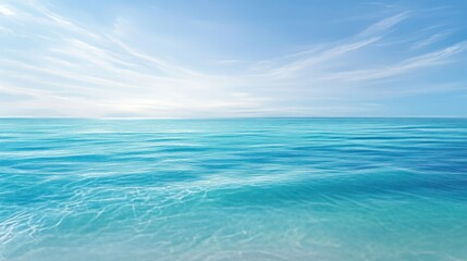 Obraz premium A Beautiful Clear Ocean And Sky With Soft Wispy Clouds