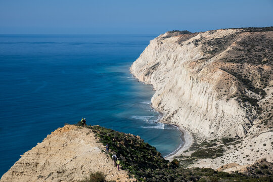 Group of people trekking in nature on a hiking trail. Healthy lifestyle. Exercising outdoor