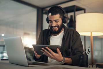 Creative, man and smile with tablet, laptop and video editor with ideas and headphones for project....