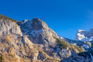 Gosausee lake in the Alps mountains in Austria. Beautiful turquoise lake in autumn with reflections of the mountain alpine peaks in water. Austria best alpine scenery and hiking vacation destination
