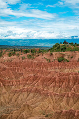 Panoramic View of the Tatacoa Desert's Unique Canyons and Rock Formations Under a Beautiful Blue Sky