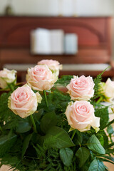 Flowers, pink roses and bouquet in home for growth, decoration and bloom. Floral plants, leaves and bunch in living room as symbol of love, valentines day gift and present for romantic celebration