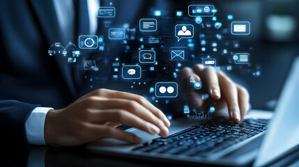 Business professional engaging with digital communication technologies at a desk in a modern office environment