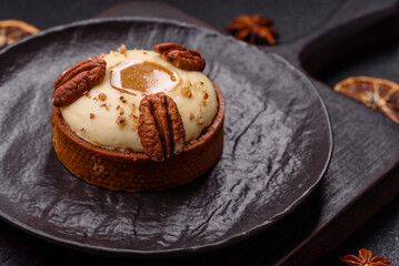 Sweet round tart with white citrus cream and pecans