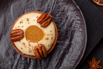 Sweet round tart with white citrus cream and pecans