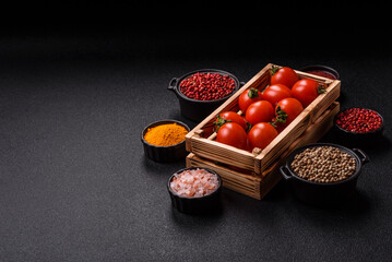Ripe red cherry tomatoes in a wooden box