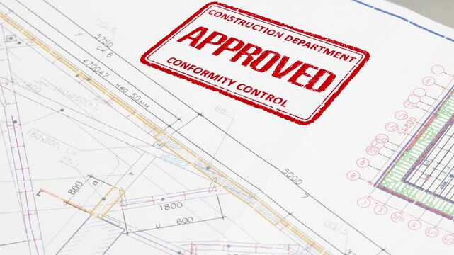 Approval of Design Drawings. A stamp is placed on the design drawing and leaves an ink imprint symbolizing compliance with standards and building permission