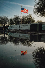 Fototapeta premium Flag reflection at construction site