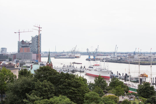 Cityscape of buildings, trees and harbor. Hamburg, Germany