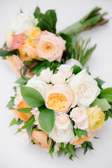 Beautiful floral bouquets with soft pastel roses and green foliage arranged elegantly for a special occasion