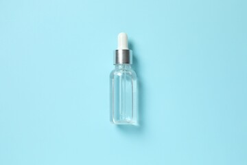 Natural cosmetic products. Cosmetic bottle a blue background, top view