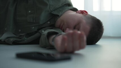 The young guy fell to the floor.
A man lies on the floor and waits for resuscitation.
Loss of consciousness.
Feeling unwell.
Severe dizziness.
Loss of balance.
Place of arrival.
Murder in an apartment