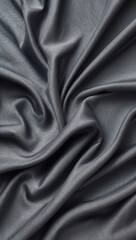 Obraz premium Gray silky fabric. Smooth shiny cloth with wavy folds. Textile background for fashion or decoration material