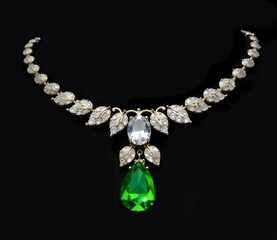 Necklace with a pendant made of green stone - emerald and large diamond