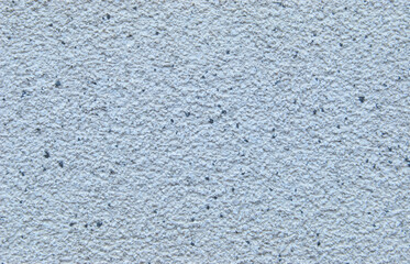 Light blue decorative flakes wall texture or pattern