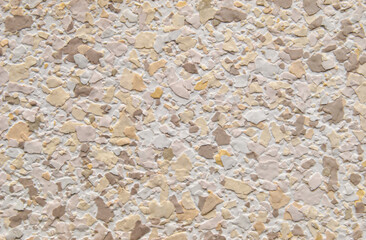 Beige decorative multi color flakes wall texture or pattern as background