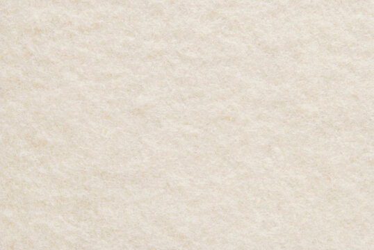 Beige soft fluffy fabric texture as background