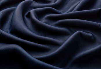 Fototapeta premium Elegant Deep Blue Fabric with Soft Folds and Smooth Texture