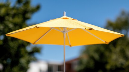 Yellow umbrella outdoors, sunny day, blurry background, outdoor setting, for advertising, products, or lifestyle