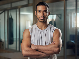 Serious, portrait or asian man with confidence for fitness, physical training or workout with gym coach. Male person, personal trainer or professional instructor with arms crossed for exercise advice