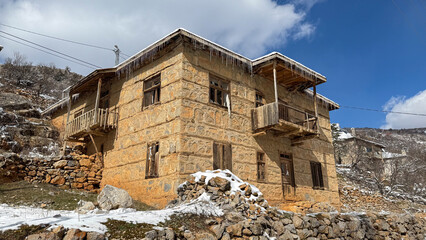 Example of old stone building construction with bay windows