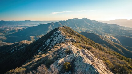 Green mountain ridges and blue skies create a beautiful landscape scene