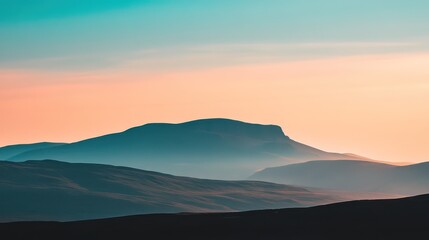 Obraz premium Beautiful misty mountains under colorful and scenic twilight skies