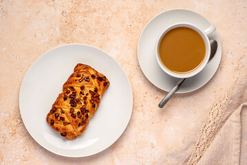 Food photography of coffee with maple and pecan plait, cappuccino with puff pastry bun with nuts, breakfast, snack