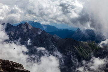 A mountain range with clouds in the sky view of the alps from zugspitze mountain in Germany mountains