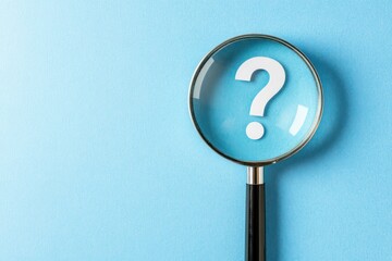 Question mark magnified, seeking answers,  light blue background