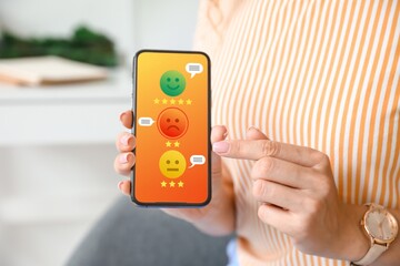Woman with mobile phone responding to survey at home