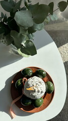 Photo of Easter table decorated in green tones.