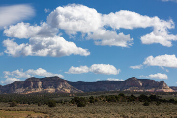Clouds over red mountains in Utah.