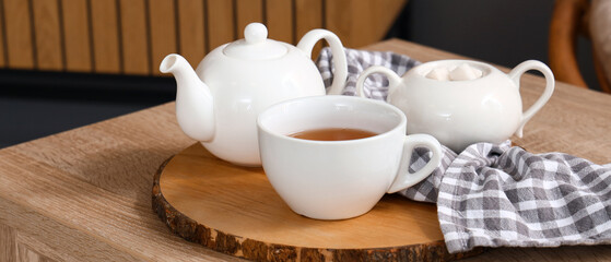 Tea set on table in living room, closeup