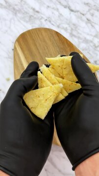 Cutting tortilla in triangles for food making