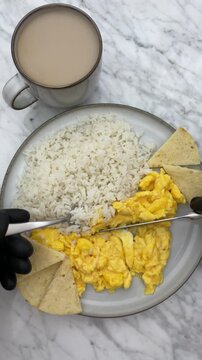 Delicious and Nutritious scrambled eggs and white rice Breakfast