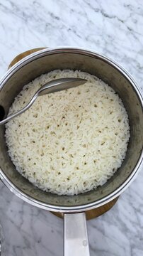 Ready to eat hot steamed white rice for recipes