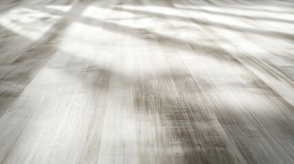 A wooden floor with long shadows and warm sunlight