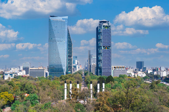 Mexico City&rsquo;s skyline, featuring modern skyscrapers, lush greenery from Chapultepec Park, and the Bosque de Chapultepec 
