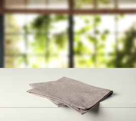 Tablecloth on white table in room, closeup