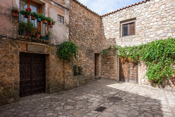 Naklejka premium cozy narrow streets of ancient Roman town Medinaceli showcase ancient cobblestone architecture and peaceful ambiance