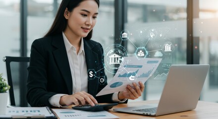 Professional Asian businesswoman analyzing financial data with digital banking interface, modern fintech visualization and online payment icons in corporate office environment