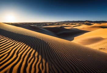 Naklejka premium stunning sand dunes dramatic shadows creating beautiful patterns under clear blue sky guiding light, landscape, desert, texture, formation, nature, horizon
