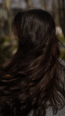 A girl with gorgeous curls and shiny hair.