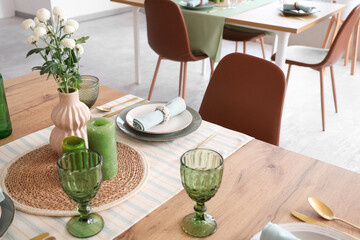 Table setting with flowers in restaurant, closeup