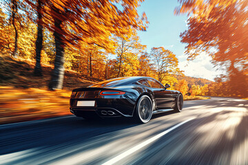 Fototapeta premium Sleek black luxury sports car racing down a vibrant autumn road under a bright blue sky