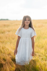  happy family and little baby.Wheat field sunny day.Little girl running through field of wheat, sunset.