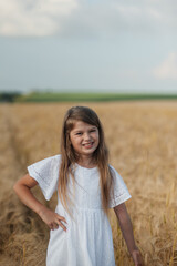hild girl running field park. girl kid run in the park wheat field