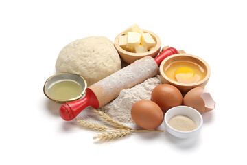 Rolling pin and different ingredients isolated on white